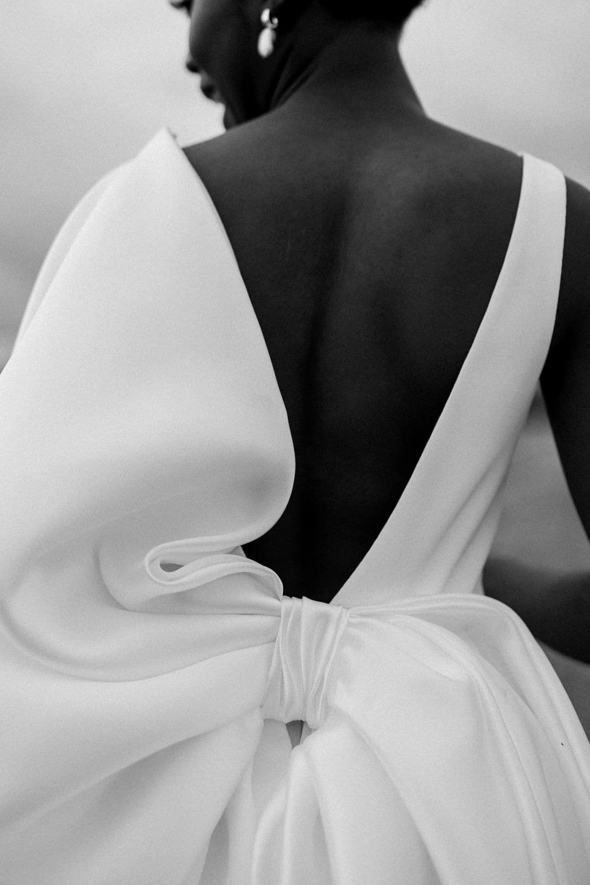 A bride in a sculptural open-back gown