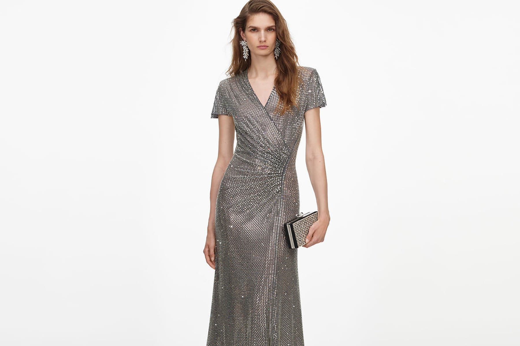 Self-Portrait's grey rhinestone mesh wrap maxi dress, worn with a silver clutch